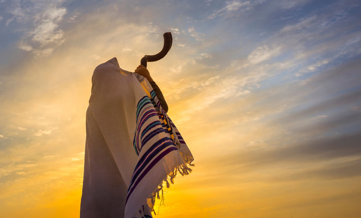 The blowing of the shofar, which begins the celebration of Rosh Hashana. (photo by John Theodor, Shutterstock.com)